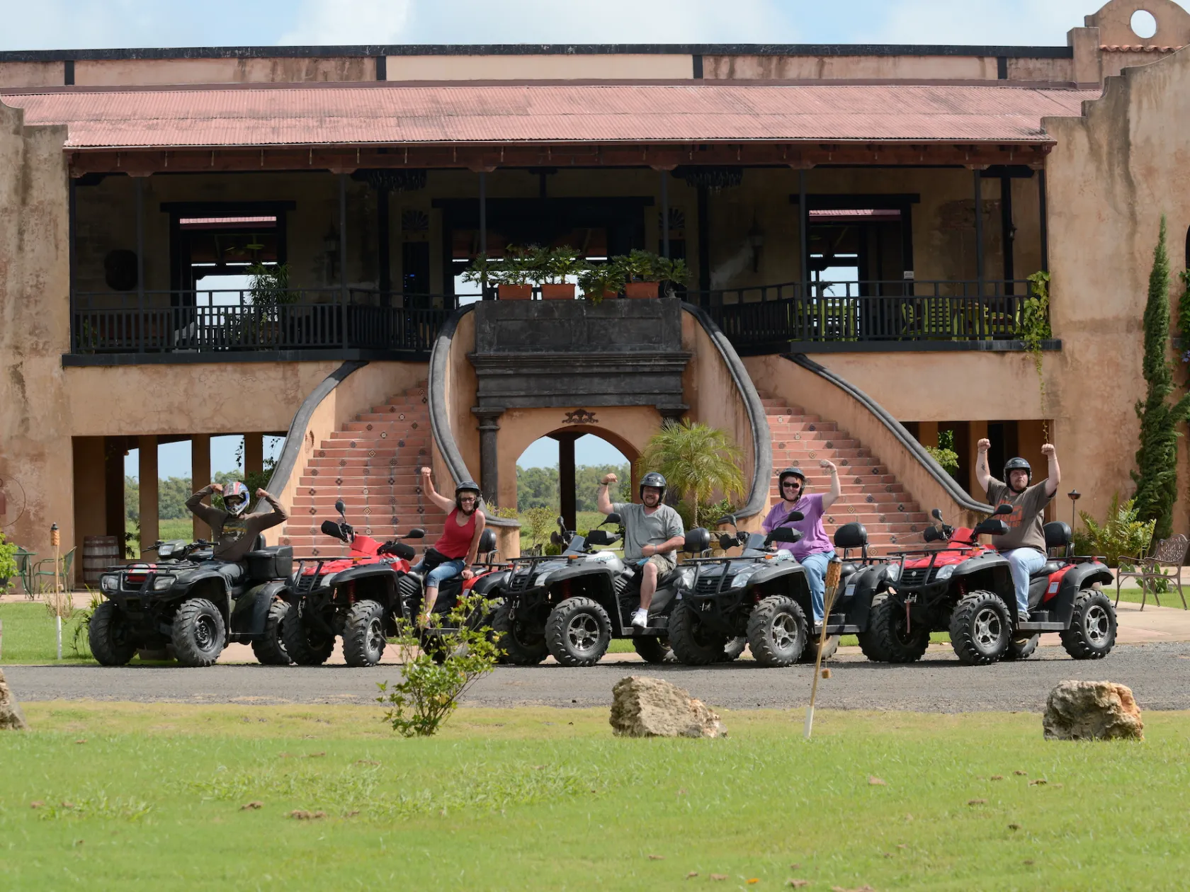 group photo on ATV's in front of hotel