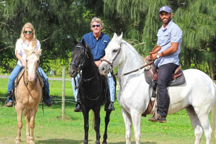 couple with tour guide on horseback